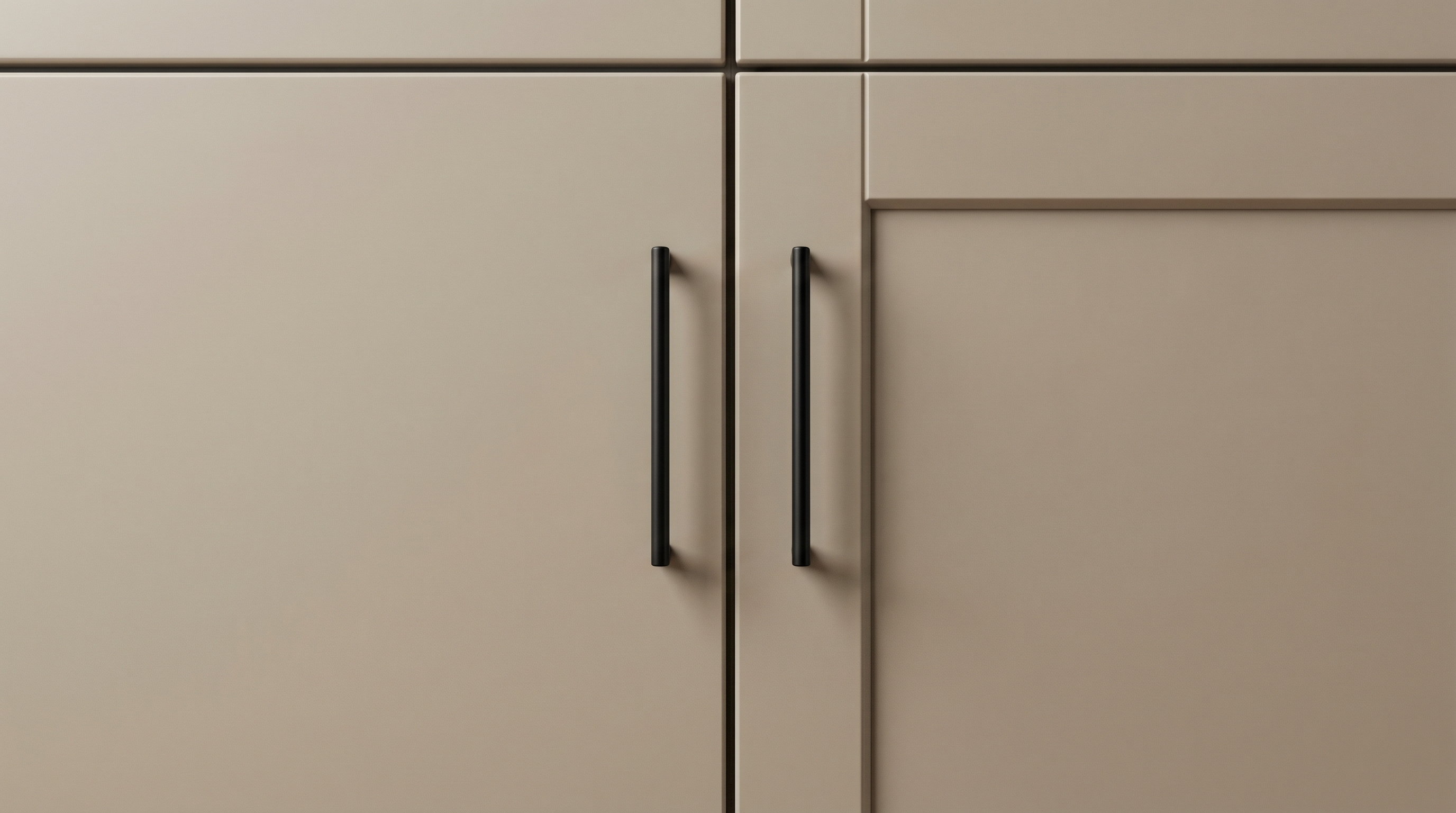 Close-up photograph showing two adjacent kitchen cabinet doors in a modern kitchen setting